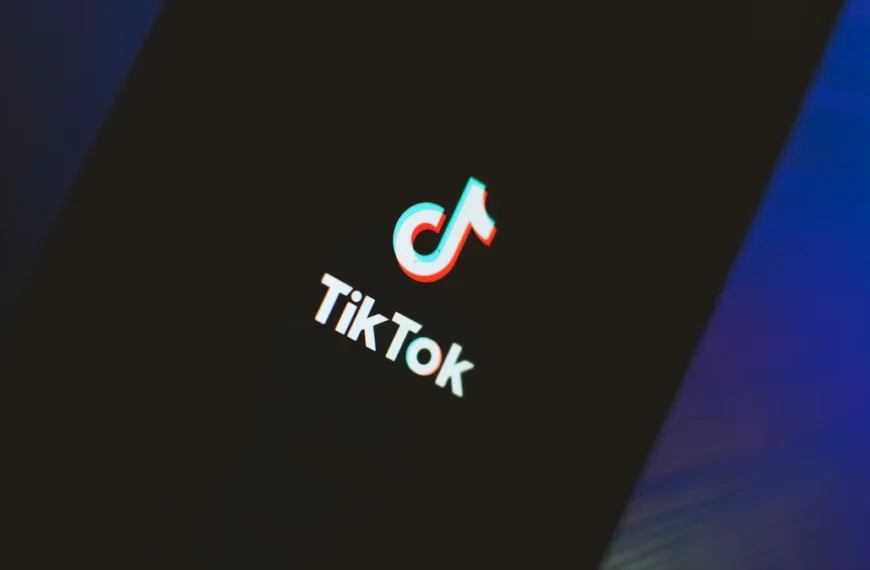 A smartphone screen displaying the TikTok logo with a dark background.