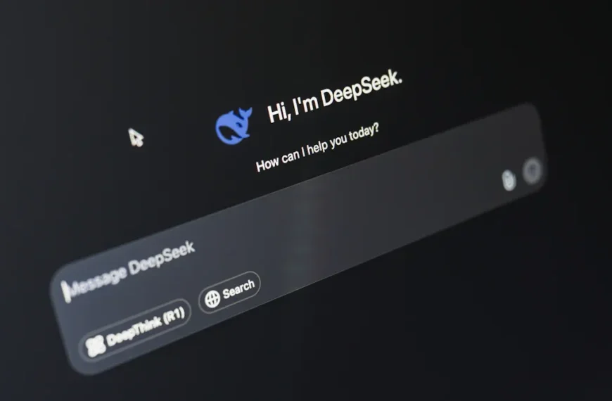 Close-up of a computer screen showing a chatbot interface with text "Hi, I'm DeepSeek. How can I help you today?" and a message input box.